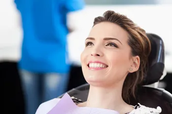 smiling woman in dental chair